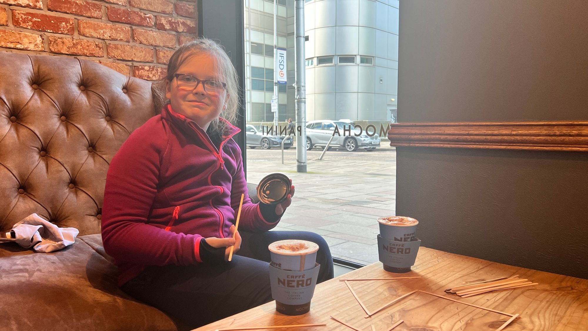 Eve with a hot chocolate at Caffè Nero a short walk off the Clyde Walkway